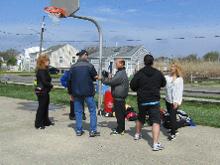 World Tai Chi & Qigong Day; Shorefront Park, Patchogue NY (April 29, 2017):  Spencer Gee (C in grey jacket), Spencer Gee Wellness Corporation in Old Westbury, has been with us for 16 of our 17 years hosting the annual event. Every year he brings a different bag of toys for his Tai Chi Workshop. This years bag included striking pads (as seen here) and a carriage whip!