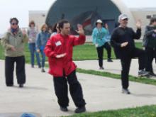 World Tai Chi & Qigong Day; Shorefront Park, Patchogue NY (April 29, 2017):  Joseph Panico (C in red), West Babylon, was the newest kid on the block this year as he joined us for his third year. Here he is introducing participants to the details of his lineage's 24-Posture Form.