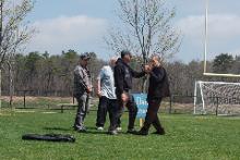 World Tai Chi & Qigong Day; Diamond in the Pines, Coram NY (April 28, 2018): Elan Abneri (R), a senior student of Tyrone Wei Wicksman at Silent Fist Tai Chi in Huntington Station, helping participants find and deepen their connection to the earth through his workshop, The Basics of Rooting.