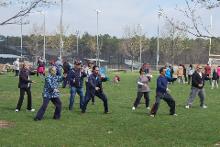 World Tai Chi & Qigong Day; Diamond in the Pines, Coram NY (April 28, 2018): Bill Donnelly (2nd from R in blue shirt), Green Cloud Kung Fu, beginning his combined workshop by introducing   participants to the art of practicing in confined spaces before a series of drills entered into through what is commonly known as the Yin / Yang Symbol, a.k.a., Tai Chi Symbol or Tai Chi Tu (Taiji tu).