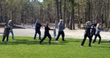 World Tai Chi & Qigong Day; Diamond in the Pines, Coram NY (April 27, 2019): Judith Budd-Walsh (R Front  in black & white), from Harmonious Movement of Port Jefferson Station, leads people through aspects of her lineages Yang-Style Long Form during her workshop, "Tai Chi Flow".