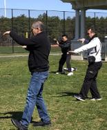 Three men playing three different empty-hand T'ai Chi Ch'uan forms.